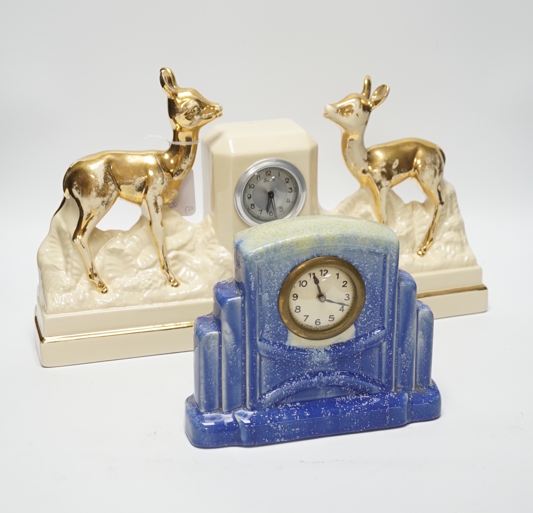 Two French ceramic mantel timepieces, largest 40cm wide